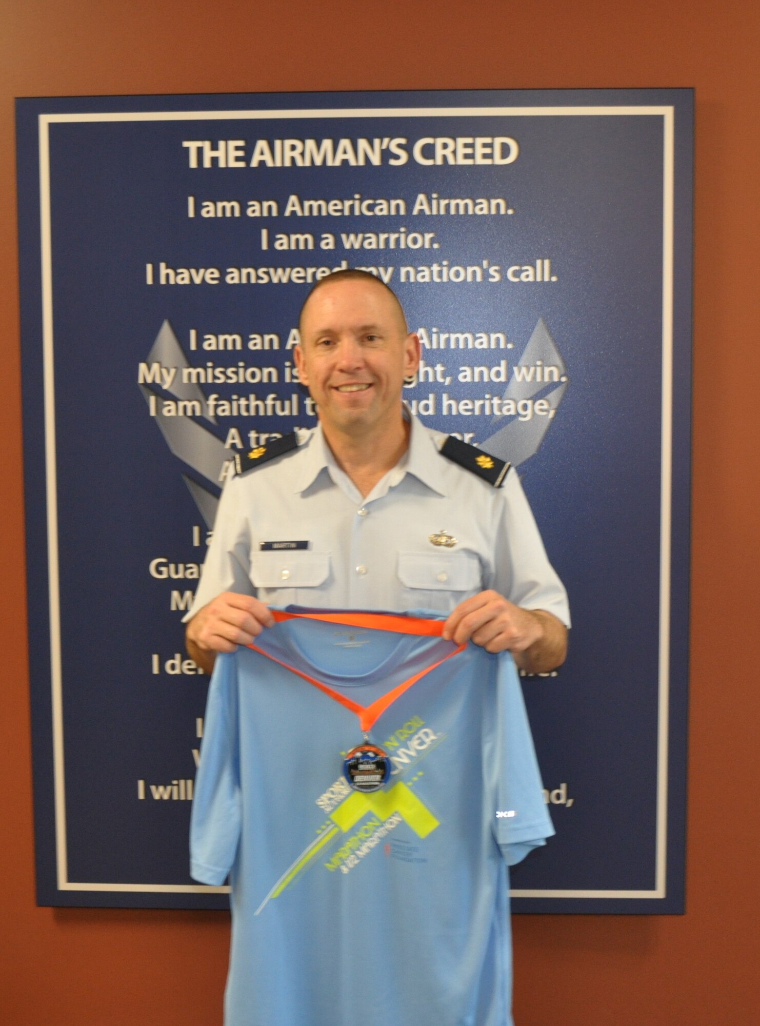 Maj. Timothy Martin, was among the finishers in the half-marathon during the Sports Authority Rock 'n' Roll Denver Marathon, half marathon, relay and inaugural 22-mile bike tour Sept. 22, 2012. (U.S. Air Force photo/Tech. Sgt. Rob Hazelett) 