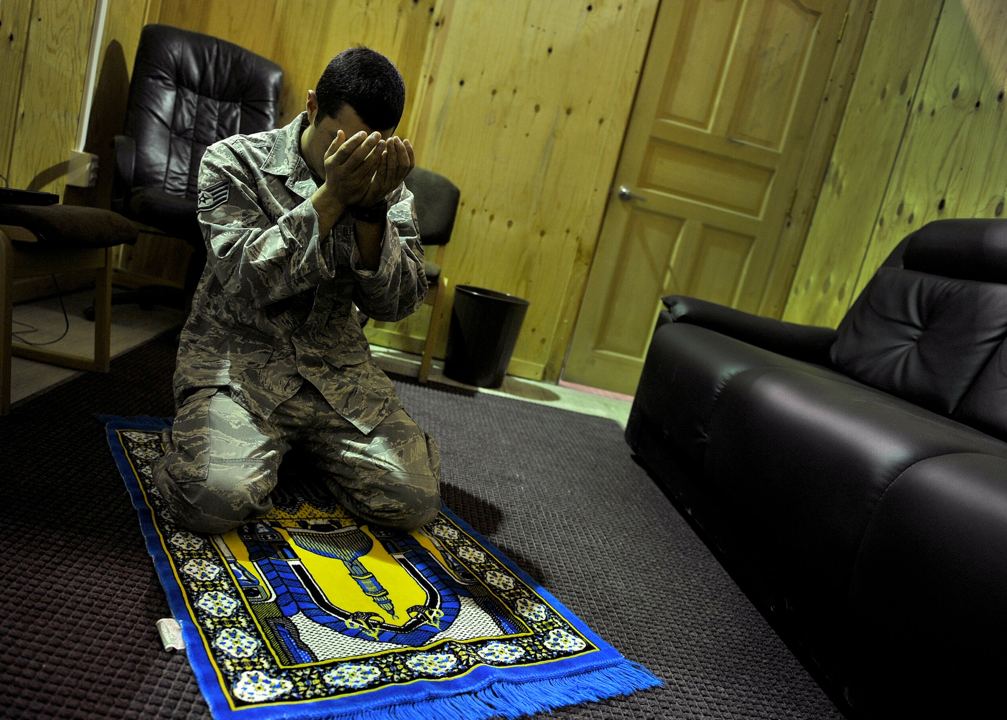 U.S. Air Force Staff Sgt. Edger Gaitan, Passenger Service NCOIC, 376th Expeditionary Logistics Readiness Squadron, prays in the distinguished visitor suite during his shift at the Passenger Terminal, Transit Center at Manas, Kyrgyzstan, Sept. 19, 2012. Gaitan spends his graveyard shift making sure deploying and redeploying U.S. and coalition members are transported properly. Gaitan is a devout Muslim who finds the time to pray daily in between mission requirements here at Manas. Gaitan has had the priveledge of serving his country while helping to mentor those around him with his strong personal values and religious beliefs. (U.S. Air Force photo/Staff Sgt. Clay Lancaster)