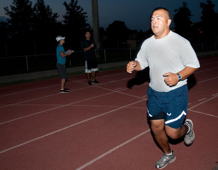 Tech. Sgt. Stanley Cruz, 728th Air Mobility Squadron, finishes his final test for the running improvement program trial at Incirlik Air Base, Turkey, Oct. 5, 2012. Running trial participants dropped an average of one minute to a minute and a half from their 1.5-mile run time. (U.S. Air Force photo by Senior Airman Daniel Phelps/Released)