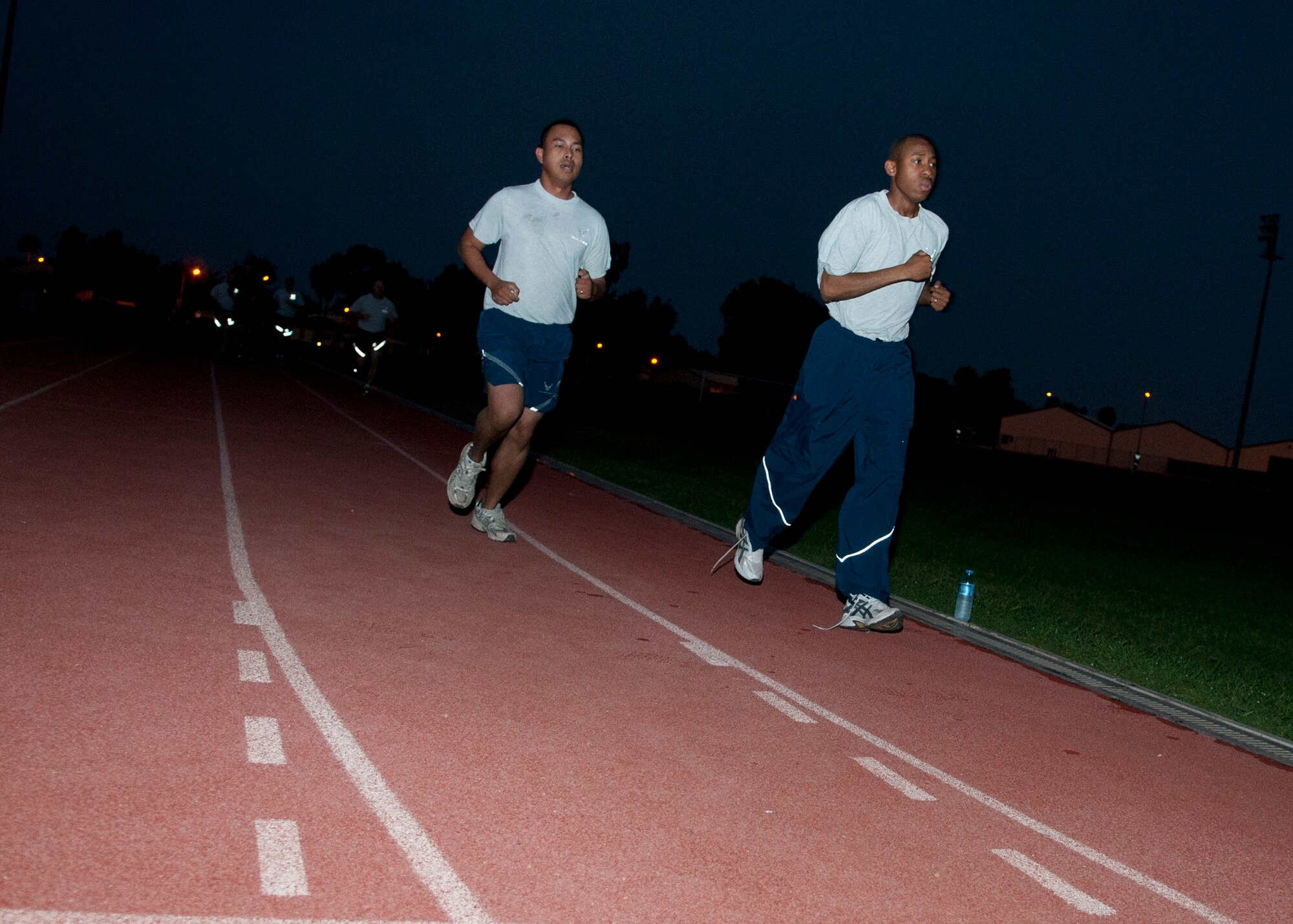 Staff Sgt. Norman Cabrera (left), 39th Logistics Readiness Squadron, and Staff Sgt. Michael Fallen(right), 39th Security Forces Squadron, complete their final test for the running improvement trial at Incirlik Air Base, Turkey,  Oct. 5, 2012. Running trial participants dropped an average of one minute to a minute and a half from their 1.5-mile run time. (U.S. Air Force photo by Senior Airman Daniel Phelps/Released)