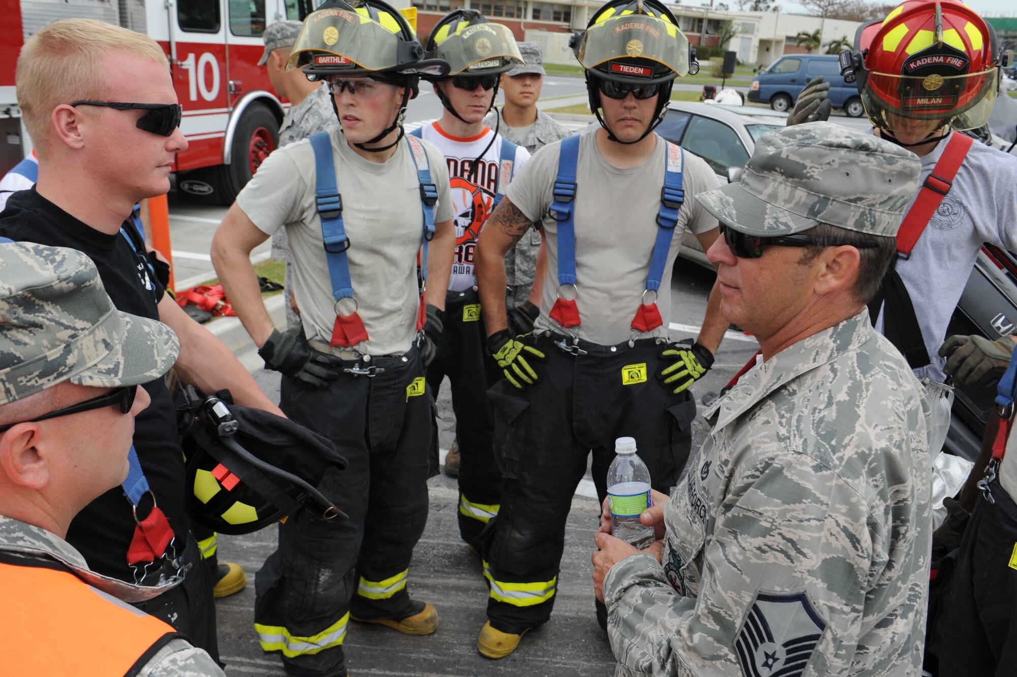 U.S. Air Force Master Sgt. Joseph Fruge, 18th Civil Engineering Squadron assistant chief of operations, gives a speech to firefighters during a vehicle extraction event for Fire Prevention Week on Kadena Air Base, Japan, Oct. 12, 2012. Firefighters use vehicle extrication, which requires dismantling pieces of the car, to safely gain access to a casualty in order to treat them for any possible injures. (U.S. Air Force photo/Airman 1st Class Malia Jenkins)