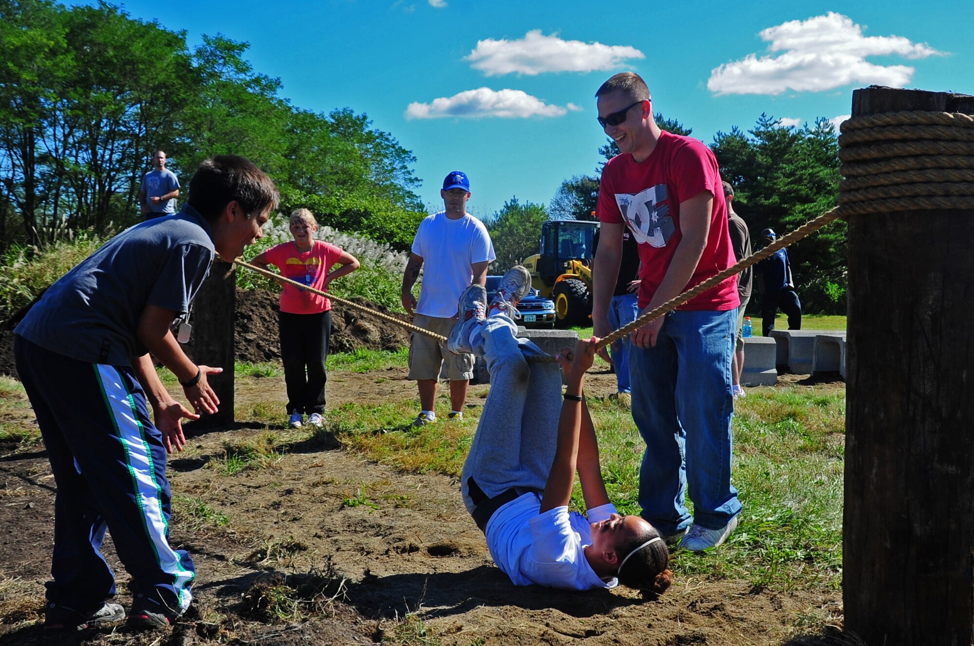 Military dependants participating in Operation Children on Deployment Exercise motivate each other through an obstacle course at Misawa Air Base, Japan, Oct. 8, 2012.  During Operation CODE the members participating are deployed to Camp Defender for a full day of training and fun.  (U.S. Air Force photo by Staff Sgt. April Quintanilla)