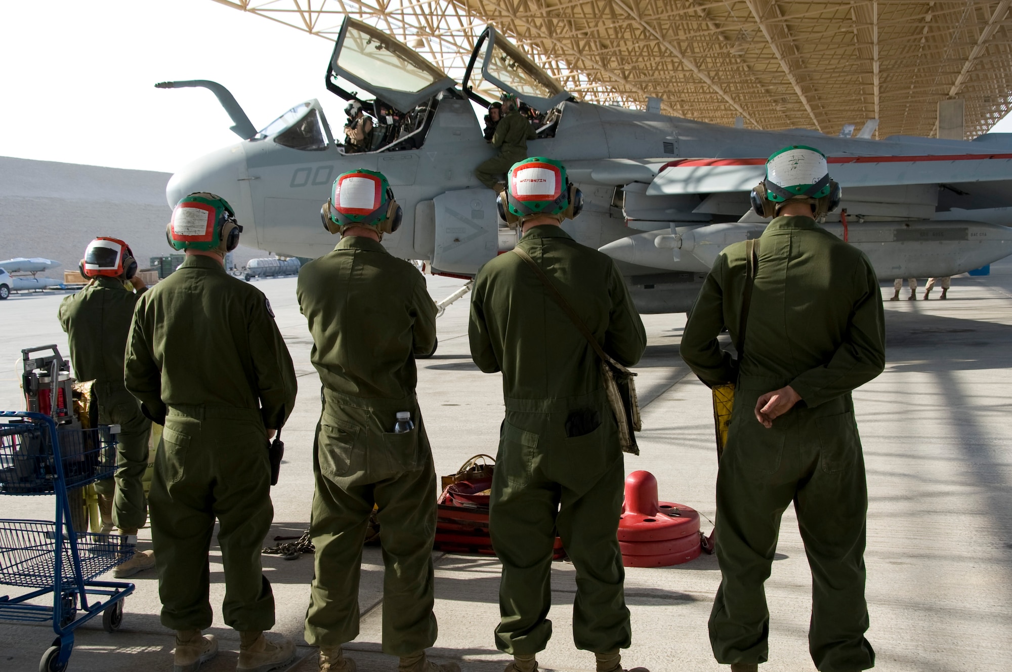Marine Tactical Electronic Warfare Squadron 3 maintainers keep a close eye on preflight checks being conducted on an EA-6B Prowler Oct. 8, 2012 in Southwest Asia. They remain close by in case any discrepancies are noticed during the checks. VMAQ-3 is an expeditionary squadron flying the EA-6B Prowler, a four-seat, twin-engine tactical electronic attack aircraft that provides radar and communications jamming capabilities. (U.S. Air Force photo/Senior Airman Bryan Swink)