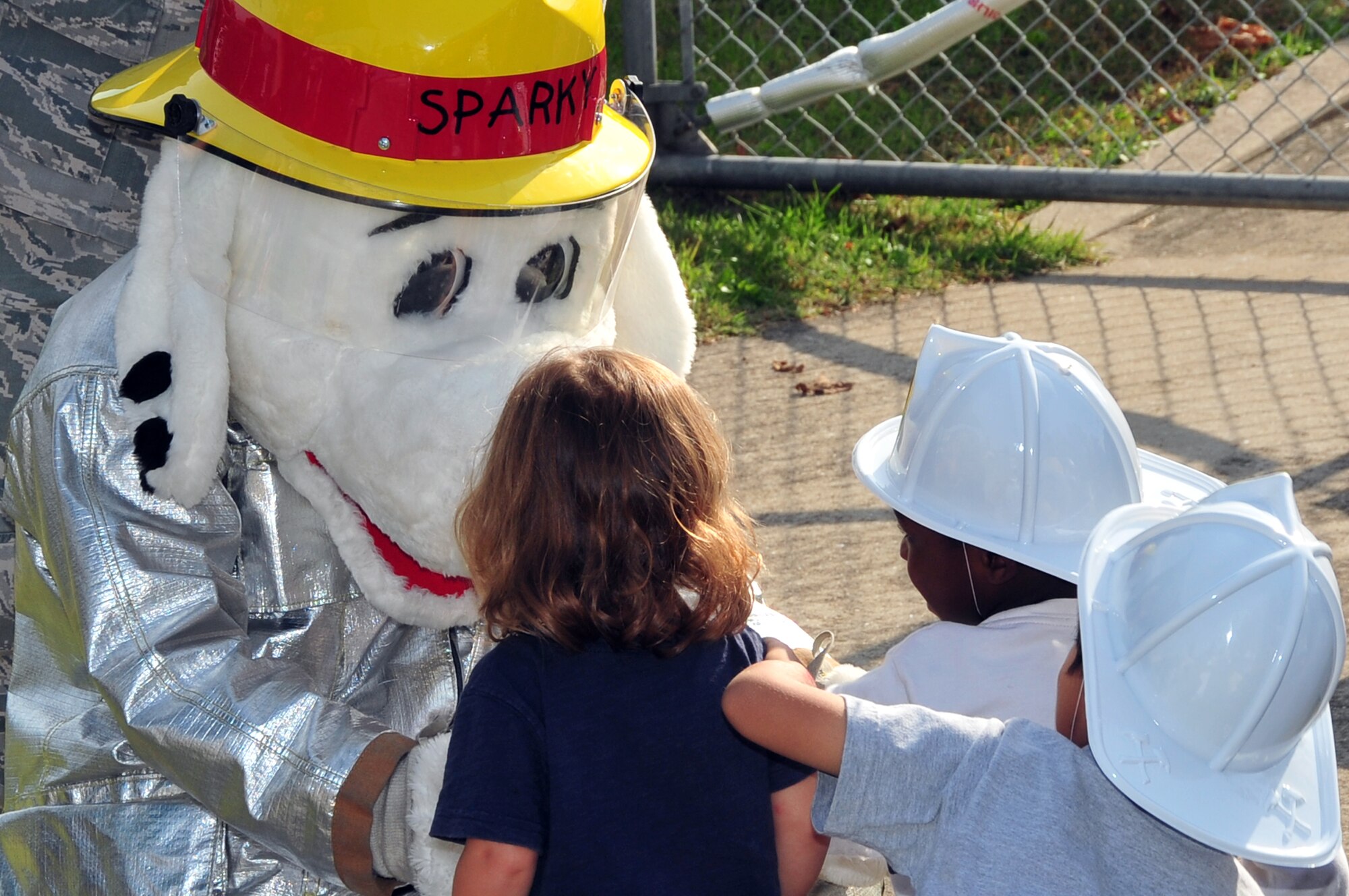 Sparky the fire dog makes an appearance at the child development center during Fire Prevention Week at Osan Air Base, Republic of Korea, Oct. 9, 2012. Sparky is a national-wide mascot for all fire departments to promote fire prevention and teach the importance of fire safety. (U.S. Air Force photo/Staff Sgt. Craig Cisek)