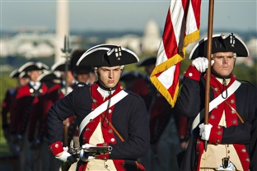 Soldiers assigned to the 3rd Infantry Regiment, known as "The Old Guard," and the Fife and Drum Corps perform during Twilight Tattoo and the Outstanding Civilian Service Award ceremony on Joint Base Myer-Henderson Hall, Va., Oct. 11, 2012.