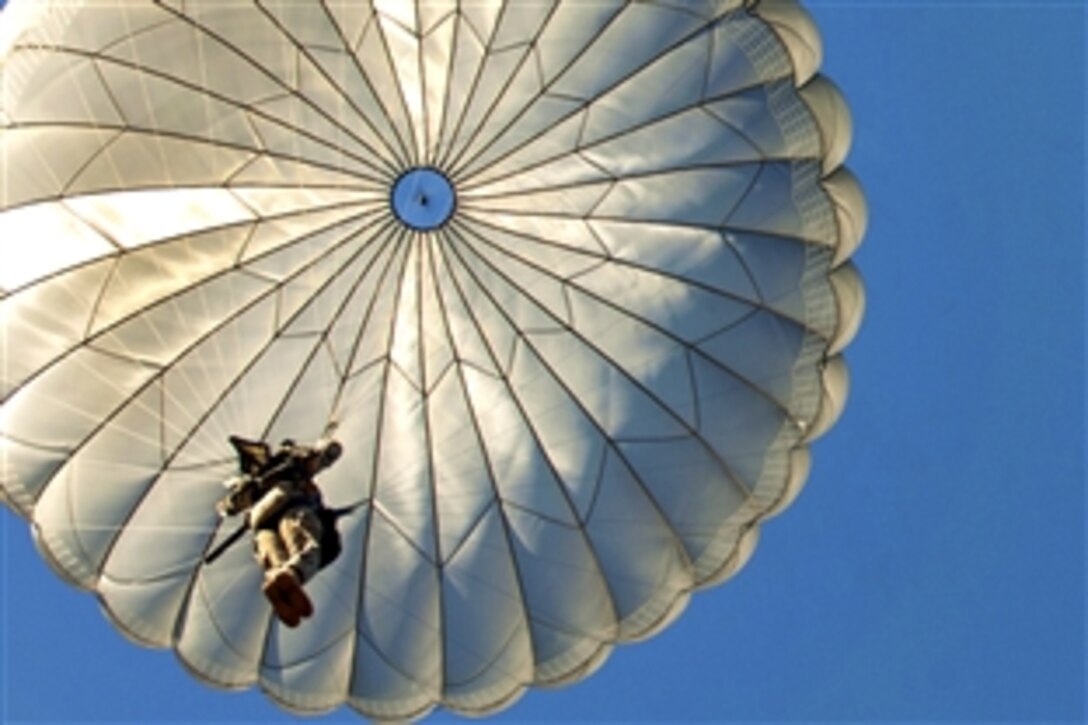 Paratroopers descend onto Fort Bragg’s Sicily Drop Zone after exiting an Air Force C-130 aircraft over Fort Bragg, N.C., Oct. 11, 2012.