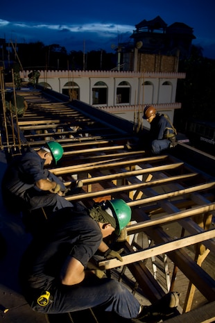 Marine Wing Support Squadron 171 Marines work during the night in Dhaka, Bangladesh, Sept. 13, 2012. MWSS-171 went to Bangladesh as part of an Engineering Civil Action Program to enhance the relationship between the United States and Bangladesh by building the second story of Hazi Joynuddin High School.