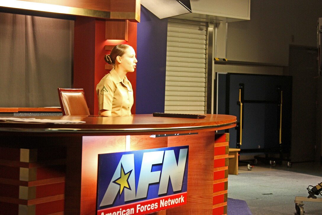Lance Cpl. Amy Douglas, American Forces Network Broadcaster, delivers the news update inside the AFN building here Oct. 10, 2012. AFN Iwakuni continues to give live news briefs to be ready for emergencies.
