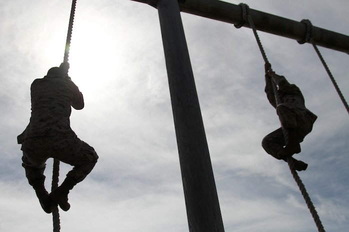 Marine Wing Support Squadron 171 Marines climb the ropes of the obstacle course during the MWSS-171 quarterly field meet here at the IronWorks Gym Oct. 5, 2012. The obstacle course was the final event of the meet, pitting all four companies of the squadron against one another in a relay race.
