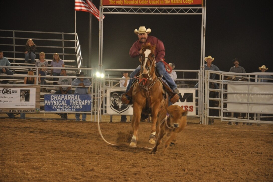 A participant successfully ropes cattle during the annual Barstow Rodeo Stampede, Sept 28 aboard Marine Corps Logistics Base Barstow, Calif. Cattle roping was just one of the many events during this year’s rodeo. Along with steer riding, goat roping, and barrel racing particpants put their skill to the test against each other.