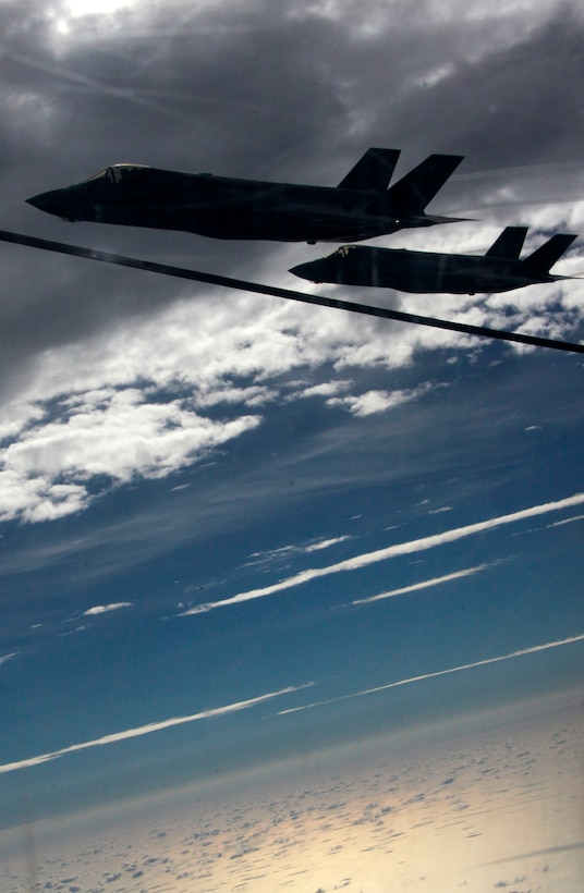 F-35B Joint Strike Fighters with Marine Fighter Attack Training Squadron 501 conduct aerial refueler training with a KC-130J Hercules with Marine Aerial Refueler Transport Squadron 252 Oct. 2in the sky near Eglin Air Force Base, Fla. It was the first time an operational Joint Strike Fighter had conducted air-to-air refueling. 