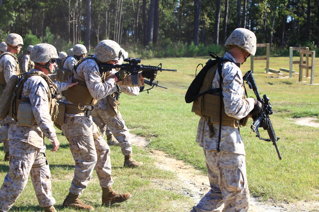 Marines with Engineer Company, Combat Logistics Regiment 2, 2nd Marine Logistics Group engage targets on the move during their pre-deployment training aboard Camp Devil Dog, N.C., Oct. 11, 2012. Approximately 50 Marines participated in the combat marksmanship training, which prepared them to rapidly fire on targets while wearing the gear they will use in the field.