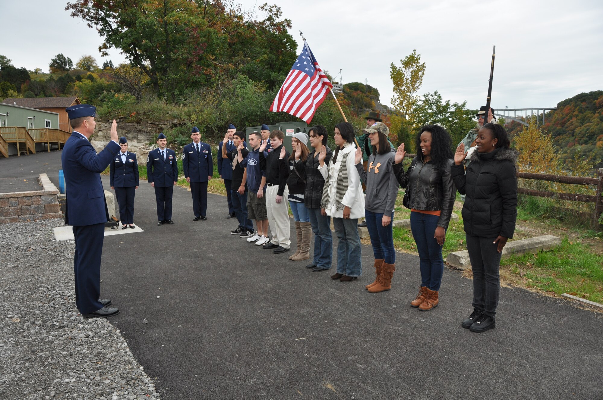 Col. Alan Swartzmiller, Commander, 914th Airlift Wing, gives the oath of enlistment to nine new Air Force Reserve members during a mass enlistment ceremony October 13 in Lewiston, N.Y.  This ceremony took place during the town's bicentennial commemoration reenactment event - Battle of Queenston Heights, the first major battle of the War of 1812.  (U.S. Air Force photo by Staff Sgt. Stephanie Clark) 