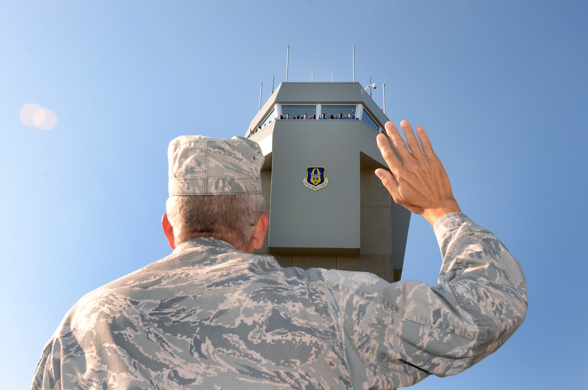 Col. Timothy E. Tarchick, 94th Airlift Wing commander, administers the the Oath of Enlistment to 19 future members of the U.S. Air Force Reserves atop of the Dobbins Air Reserve Base control tower during a mass enlistment ceremony Oct. 13. The ceremony was the first of its kind for Dobbins. (U.S. Air Force photo/Brad Fallin)