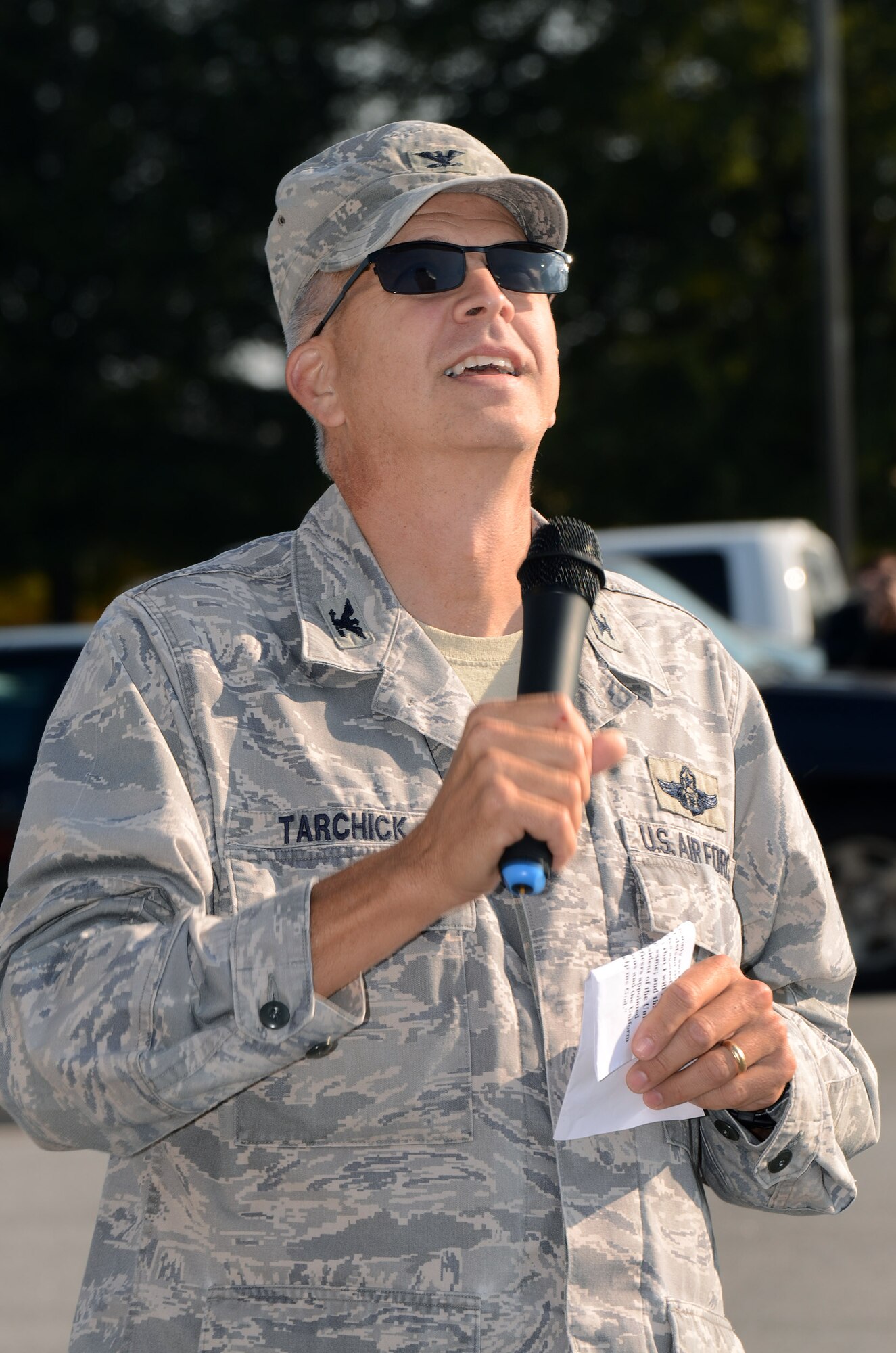 Col. Timothy E. Tarchick, 94th Airlift Wing commander, administers the the Oath of Enlistment to 19 future members of the U.S. Air Force Reserves atop of the Dobbins Air Reserve Base control tower during a mass enlistment ceremony Oct. 13. The ceremony was the first of its kind for Dobbins. (U.S. Air Force photo/Brad Fallin)