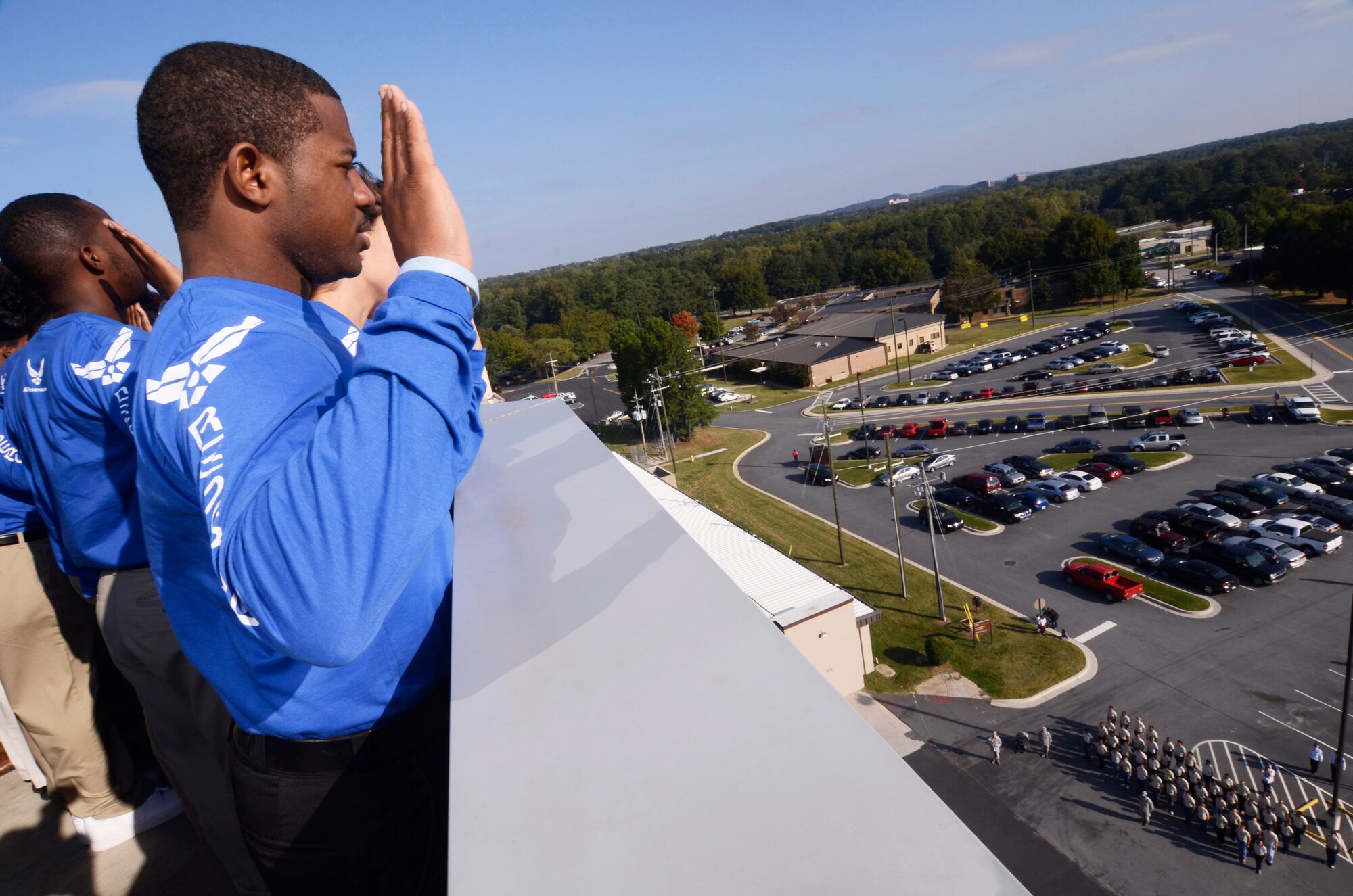 Future U.S. Air Force Reservists take the Oath of Enlistment at a mass enlistment ceremony atop of the Dobbins Air Reserve Base control tower Oct. 13. On the ground with microphone in hand, Col. Timothy E. Tarchick, 94th Airlift Wing commander, looked up and shouted “You’re in; congratulations!” The ceremony was the first of its kind for Dobbins. (U.S. Air Force photo/Don Peek)