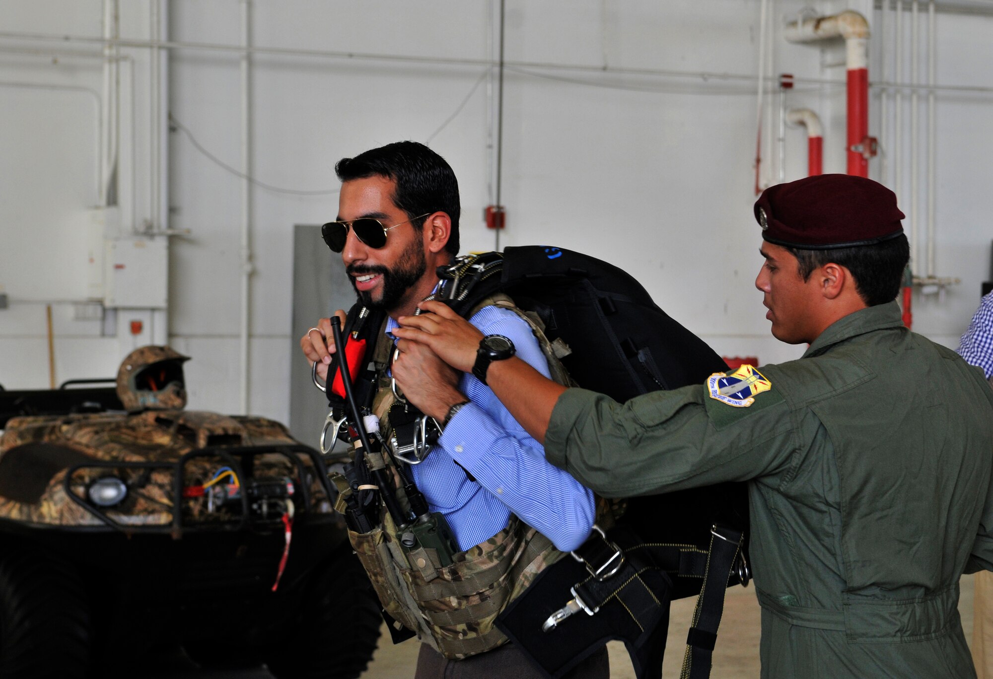 Senior Airman Kristopher Tomes, 920th Rescue Wing pararescueman suits up Daniel Leiva, a legal assistant for Congressman John Boehner. Leiva was one of several congressional staffers that traveled to Patrick Air Force Base, Fla., for a first-hand look at the 920th‘s rescue mission. (U.S. Air Force photo/Tech. Sgt. Peter Dean) 