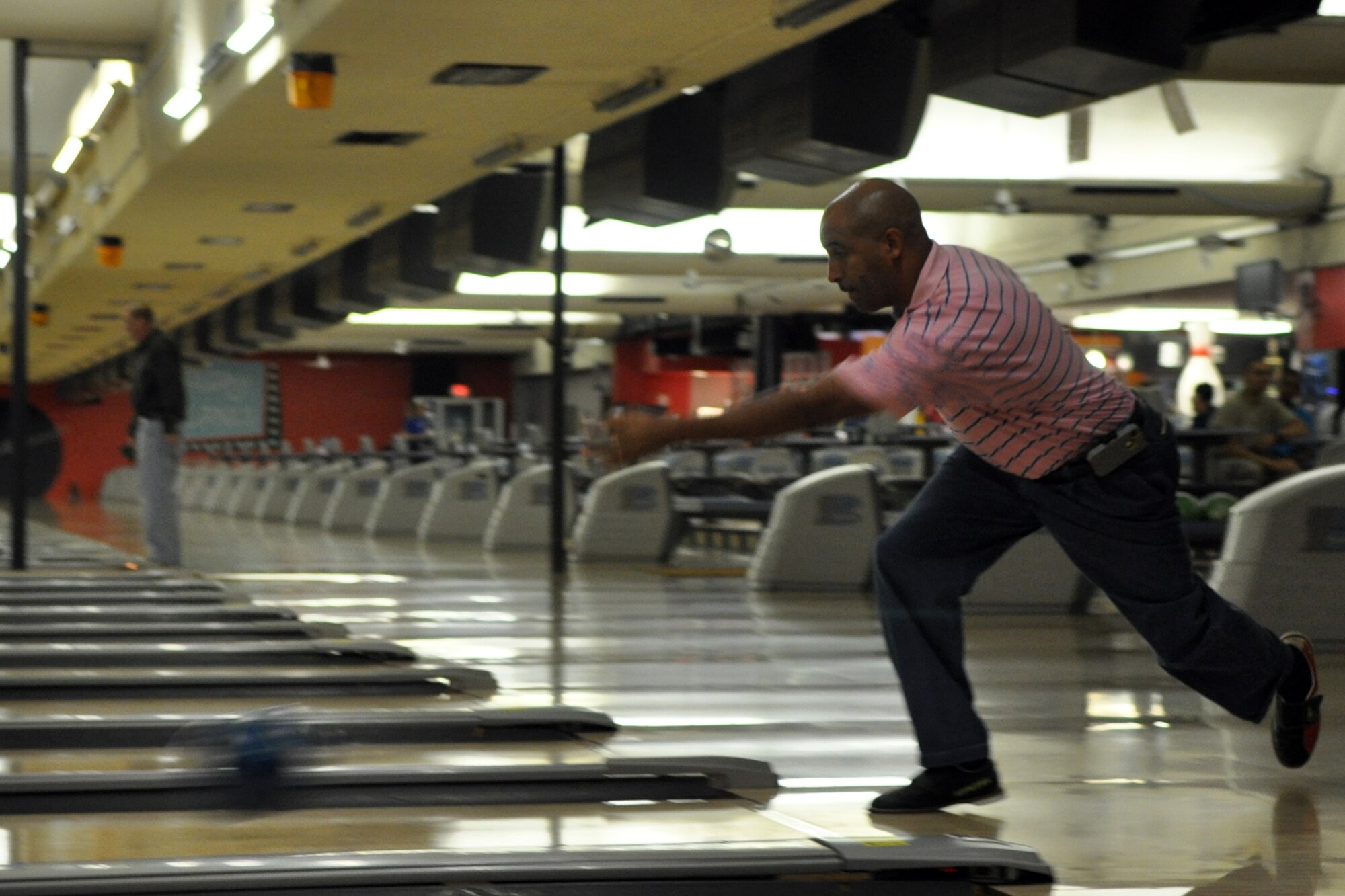 Shaun Piernas rolls for a strike during the first of a three game elimination tournament at the Holiday Lanes in Bossier City, La., Oct. 12, 2012. Piernas competed in the 3rd annual Members & Military Bowling Tournament sponsored by the Bossier Chamber of Commerce Business members. The annual tournament is a continuation of the Celebrate Barksdale Picnic in appreciation of the Barksdale Military Community. Pizza and soft drinks were donated to the bowlers from a host of local business sponsors. The 307th BW team took 3rd Place overall in the tournament.  (U.S. Air Force photo by Master Sgt. Jeff Walston/Released)