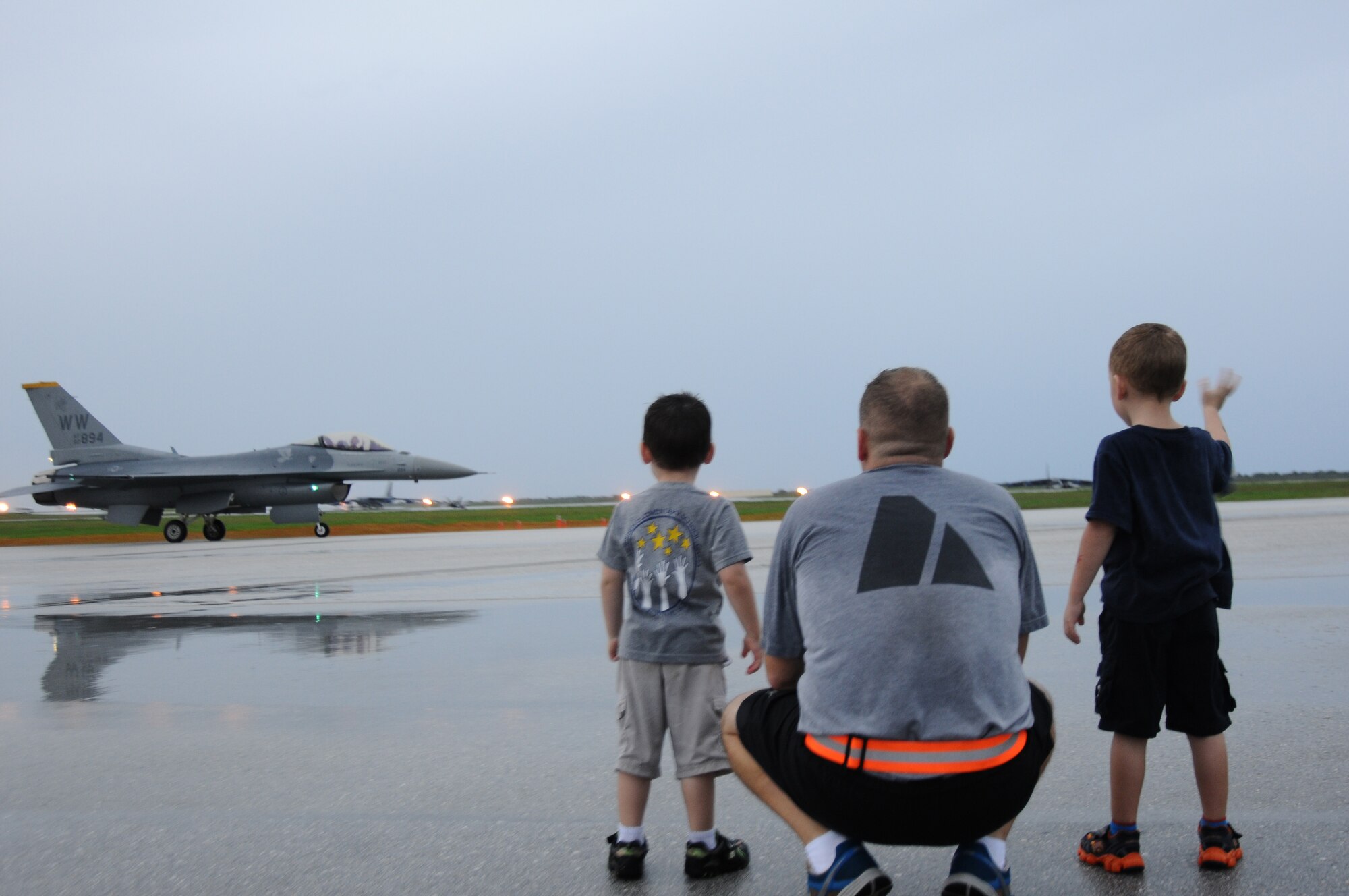Guests of the 2012 Andersen Air Force Base Open House in Guam watch as an F-16 Fighting Falcon from the Pacific Air Forces F-16 Demonstration Team prepares to take off Oct. 12. The demonstration team, which is based at Misawa Air Base, Japan, flies the Block 50 version of the Air Force's F-16 Fighting Falcon.  The event also included static aircraft displays and military demonstrations from units throughout U.S. Pacific Command. (U.S. Air Force photo by Senior Airman Carlin Leslie/Released)