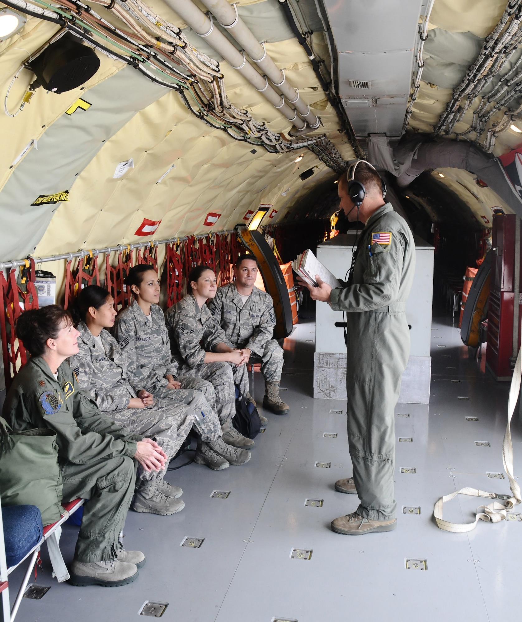 Maj.Dana Baker, 36th Medical Group aerospace medicine flight commander, accompanies her Airmen on an incentive flight Oct.11 here. The flight served as an opportunity for flight crew and medical personnel to interact with each other during mid-air refuelings. (U.S. Air Force photo by Airman 1st Class Mariah Haddenham/Released)