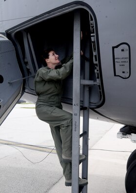 Maj. Dana Baker, 36th Medical Group aerospace medicine flight commander, boards an incentive flight Oct. 11 here. The flight served as an opportunity for flight crew and medical personnel to interact with each other during mid-air refuelings. (U.S. Air Force photo by Airman 1st Class Mariah Haddenham/Released)