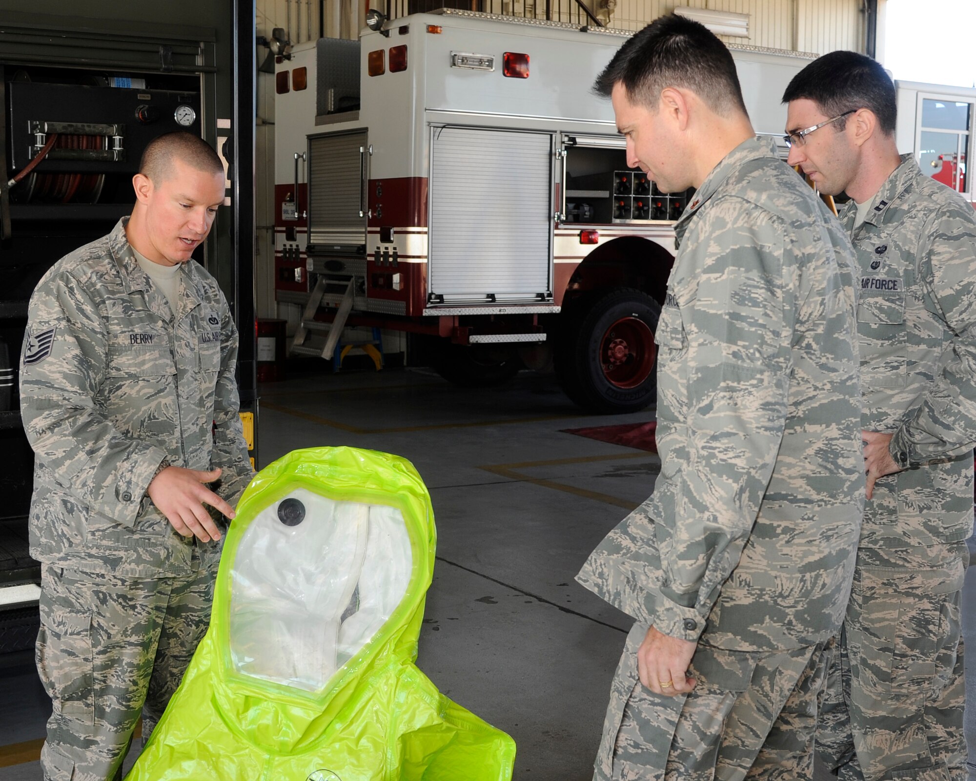 Tech. Sgt. Jarrod Berry, 8th Civil Engineer Squadron fire inspector, teaches Airmen about the hazardous material suits firefighters wear during fire safety week at Kunsan Air Base, Republic of Korea, Oct. 11, 2012. The Airmen also learned about different tools firefighters use to rescue people from vehicles such as the Jaws of Life and the gear they wear for fire protection. (U.S. Air Force photo/Senior Airman Marcus Morris) 