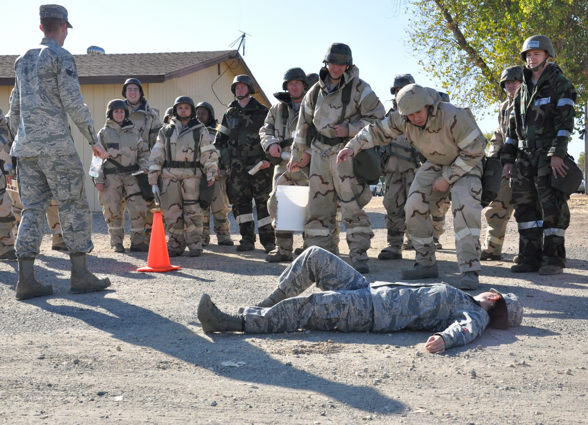Airman 1st Class Jessica Dunlap, from the 9th Civil Engineering Squadron’s Readiness and Emergency Management flight, mocks a broken leg for the Post Attack Reconnaissance training portion.  Members of the 940th Wing joined the 9th Reconnaissance Wing for the “Ability to Survive and Operate” training during the October Unit Training Assembly.  (U.S. Air Force photo/ Senior Airman Adam Hamar)