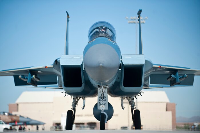 An F-15D Eagle piloted by Capt. David Vincent, 65th Aggressor Squadron pilot, with retired United States Air Force Brig. Gen. Charles E. "Chuck" Yeager taxis to the runway before taking off Oct 14, 2012, at Nellis Air Force Base, Nev. This flight marks the 65th anniversary of Yeager's breaking of the sound barrier.(U.S. Air Force photo by Airman 1st Class Jason Couillard)