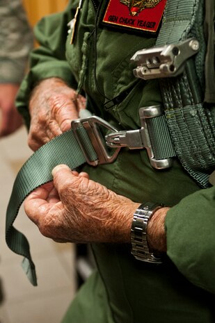 Retired United States Air Force Brig. Gen.Charles E. " Chuck" Yeager adjusts his harness at the 65th Aggressor Squadron before his flight Oct. 14, 2012, at Nellis Air Force Base, Nev. When Yeager broke the sound barrier in 1947, he was flying the Bell X-1 rocket research plane named the "Glamorous Glennis" over Edwards Air Force Base, Calif. (U.S. Air Force photo by Airman 1st Class Jason Couillard)