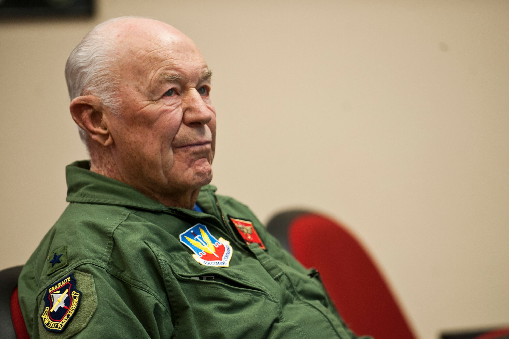Retired United States Air Force Brig. Gen. Charles E. "Chuck" Yeager listens to a pre-flight briefing at the 65th Aggressor Squadron Oct 14, 2012, at Nellis Air Force Base, Nev. Yeager was the first pilot to break the sound barrier in 1947, and commemorated the 65th anniversary of the event by flying in an F-15D Eagle with the 65th AGRS. (U.S. Air Force photo by Airman 1st Class Jason Couillard)