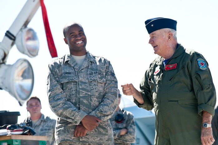 Senior Airman Anthony Ewing, 757th Aircraft Maintenance Squadron dedicated crew chief, and retired United States Air Force Brig. Gen. Charles E. "Chuck" Yeager share a laugh after Yeager's 65th anniversary of breaking the sound barrier flight in a 65th Aggressor Squadron F-15D Eagle Oct. 14, 2012, at Nellis Air Force Base, Nev.  Yeager was the first man to fly faster than the speed of sound while a test pilot at Edwards AFB, Calif. (U.S. Air Force photo by Lawrence Crespo)