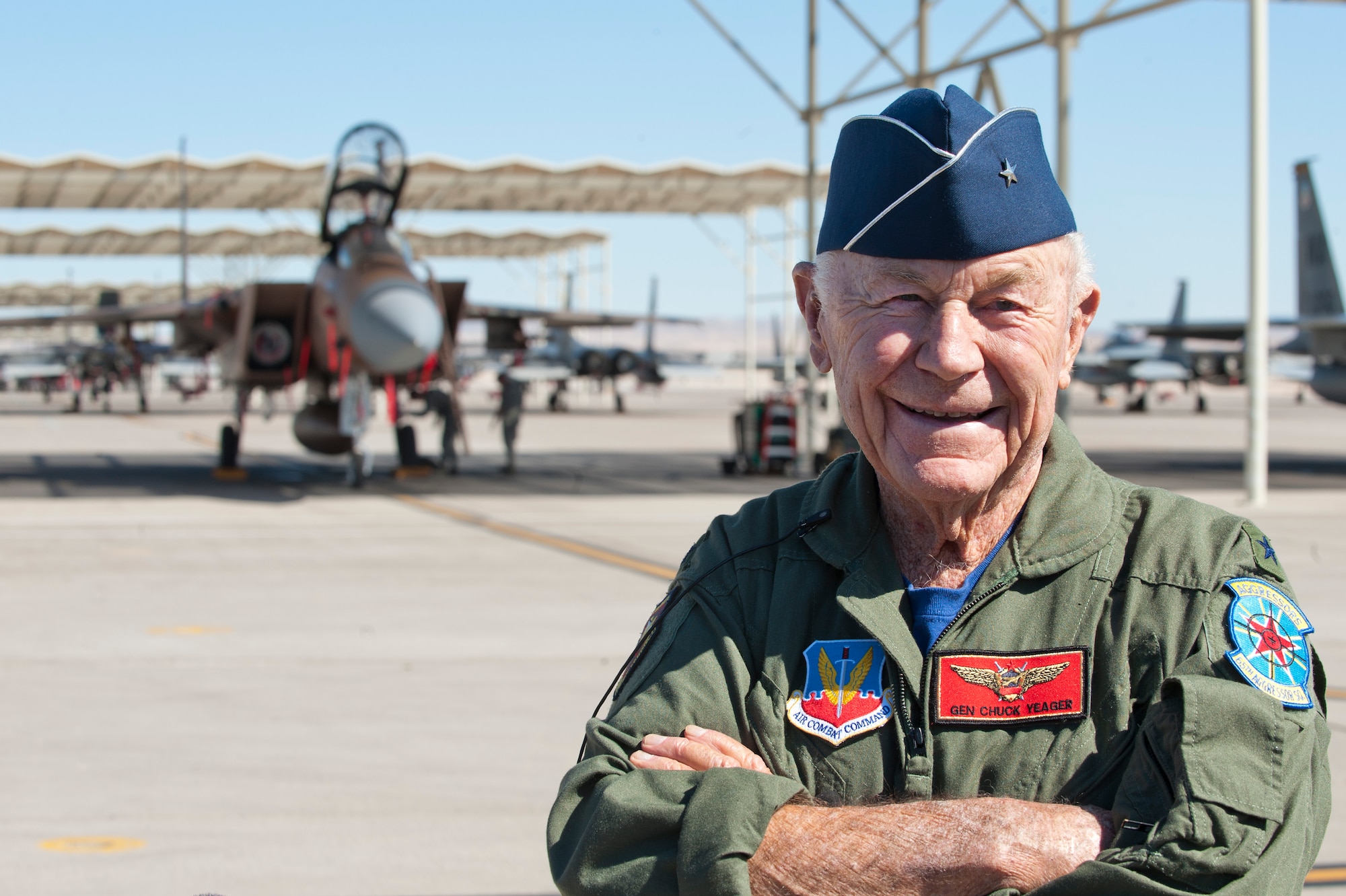 Retired United States Air Force Brig. Gen. Charles E. "Chuck" Yeager poses for photographers after returning from his 65th anniversary of breaking the sound barrier flight aboard a 65th Aggressor Squadron F-15D Eagle piloted by Capt. David Vincent, 65th AGRS, at Nellis Air Force Base, Nev., Oct. 14, 2012. Yeager became the first man to break the sound barrier Oct. 14, 1947, over Edwards Air Force Base, Calif. (U.S. Air Force photo by Lawrence Crespo)