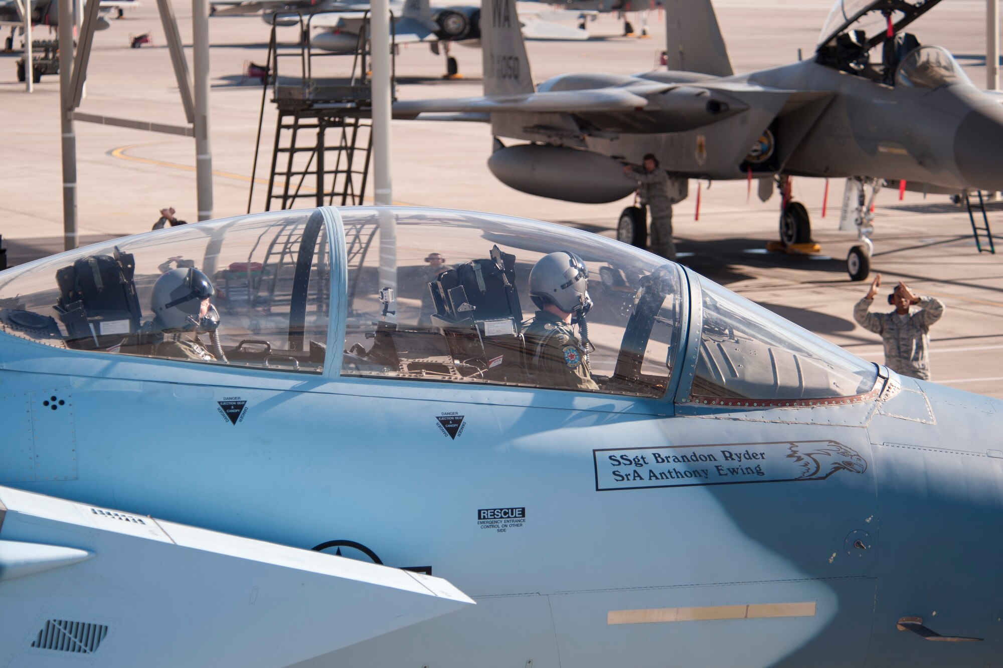 Retired United States Air Force Brig. Gen. Charles E. "Chuck" Yeager and Capt. David Vincent, 65th Aggressor Squadron pilot, taxi to the active runway in an F-15D Eagle Oct. 14, 2012, at Nellis Air Force Base, Nev. Yeager and Vincent commemorated the 65th anniversary of breaking of the sound barrier by flying from Las Vegas to Edwards AFB in southern California. (U.S. Air Force photo by Lawrence Crespo)