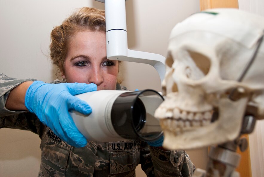 Senior Airman Candis Rogers, a dental assistant from the 133rd Airlift Wing Medical Group practices taking an x-ray on a human skull for Readiness Skills Verification (RSV) training on Oct. 13, 2012 St. Paul, MN. U.S. Air Force photo by Staff Sgt. Austen Adriaens/released