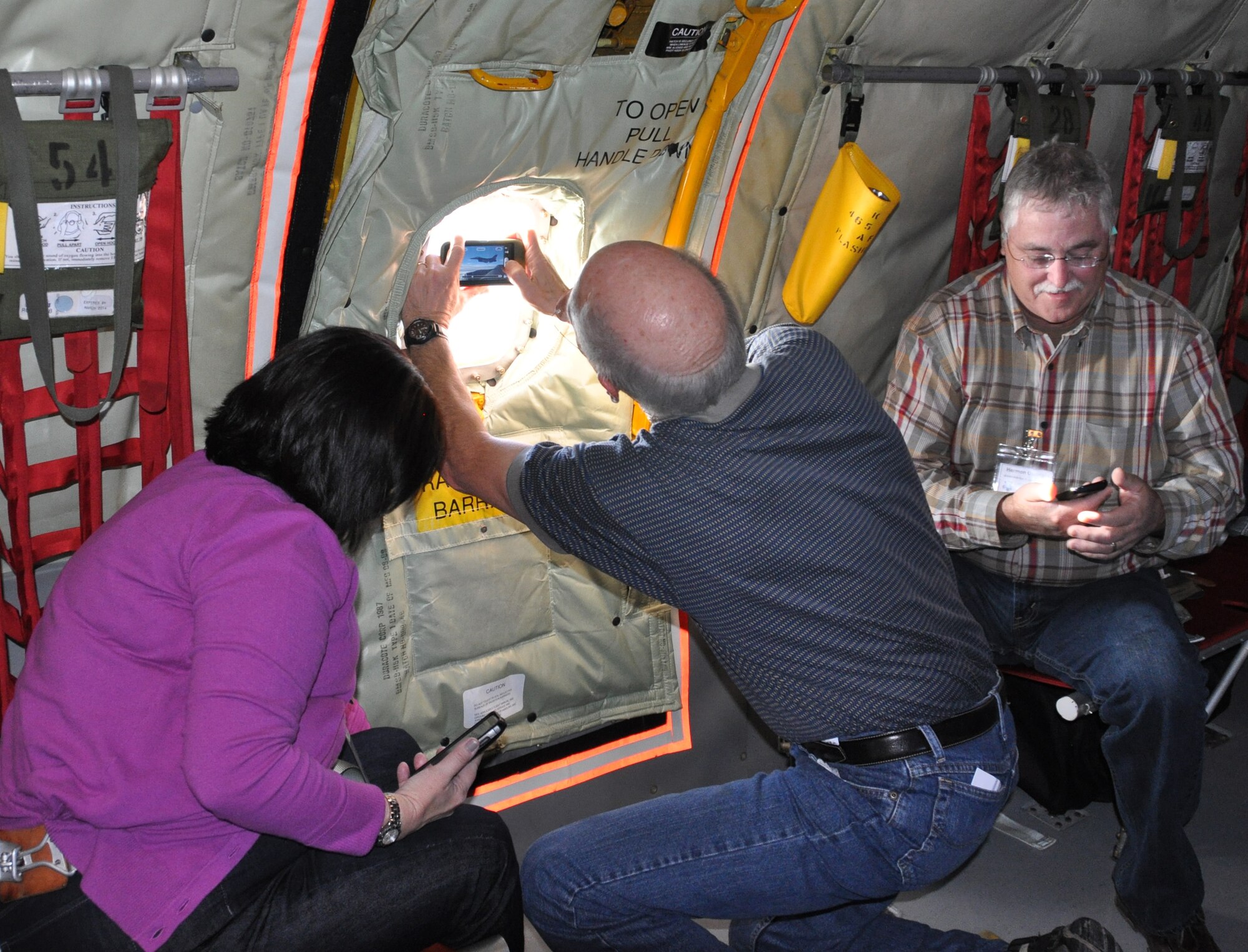 NAVAL AIR STATION FORT WORTH JOINT RESERVE BASE, TEXAS -- A group of civilian employers take pictures during a refueling operation flight Saturday, Oct. 13. The flight was part of several activities during employer appreciation day the group took part in. The goal of employer's day was to show appreciation for civilian employers who support Reservists assigned to the 301st Fighter Wing. The KC-135R and it's crew was provided by the 507th Air Refueling Wing. (U.S. Air Force photo/Senior Airman Melissa Harvey)