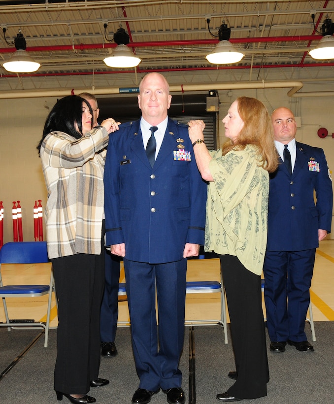 On hand to pin on the eagle insignia were his wife, Antonina, and sister, retired Air Force Master Sgt. Madonna Rogers. Col. Rogers joined the 107th Airlift Wing in 1984 as an enlisted Airman in the base supply section. He has studied hard and worked his way up the ranks. Col. Rogers graduated from the State University of New York College at Buffalo in 1990 then received his commission as an officer in 1991.Oct. 13, 2012 (U.S. Air Force Photo/Senior Master Sgt. Ray Lloyd)
