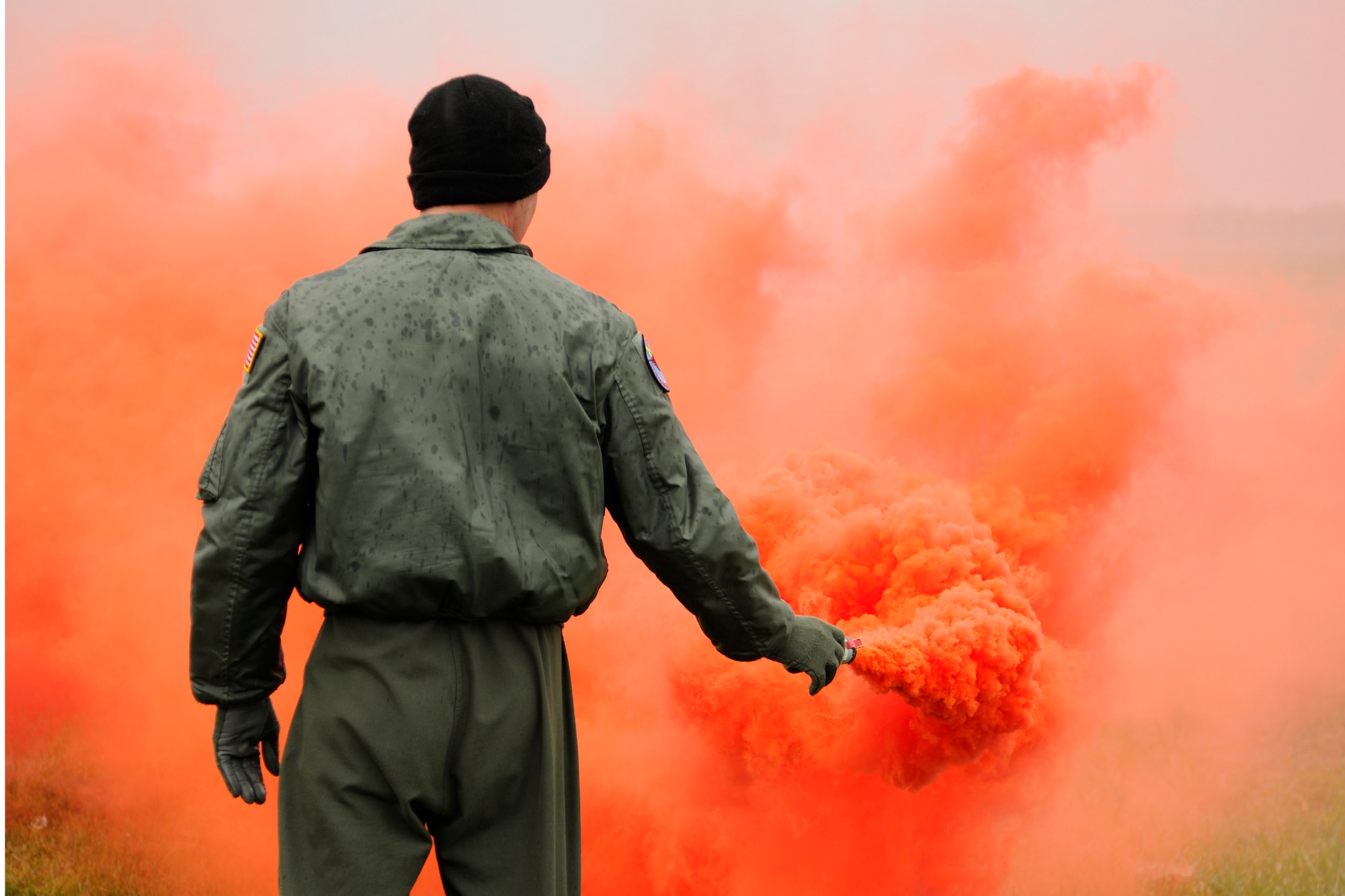 A member from the 127th Air Refueling Group discharges an MK 124 flare canister during a signal flare training exercise on Selfridge Air National Guard Base, Mich., October 13, 2012.  Several flight crews participated in training using different survival tools such as the MK 124 flare.   (U.S. Air Force photo by TSgt. David Kujawa)