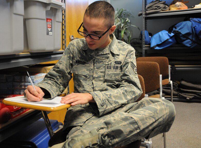 Senior Airman Chris Winship, 267th Combat Communications Squadron cyber transport technician, fills out medical paperwork prior to his dental exam at the 102nd Medical Group building on Otis Air National Guard Base, Mass. Oct. 13. Winship was one of approximately 120 servicemembers who received complimentary dental treatment from Logistics Health dental professionals thorughout the weekend. (Air National Guard photo by Senior Airman Patrick McKenna/Released,