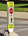 According to California state law, mortorist are required to give right-of-way to civilians who have entered the crosswalk. However, pedestrians should also take caution when entering crosswalks to ensure they do not cause oncoming vehicles to stop suddenly, potentially causing an accident. (U.S. Air Force photo by Linda Welz)