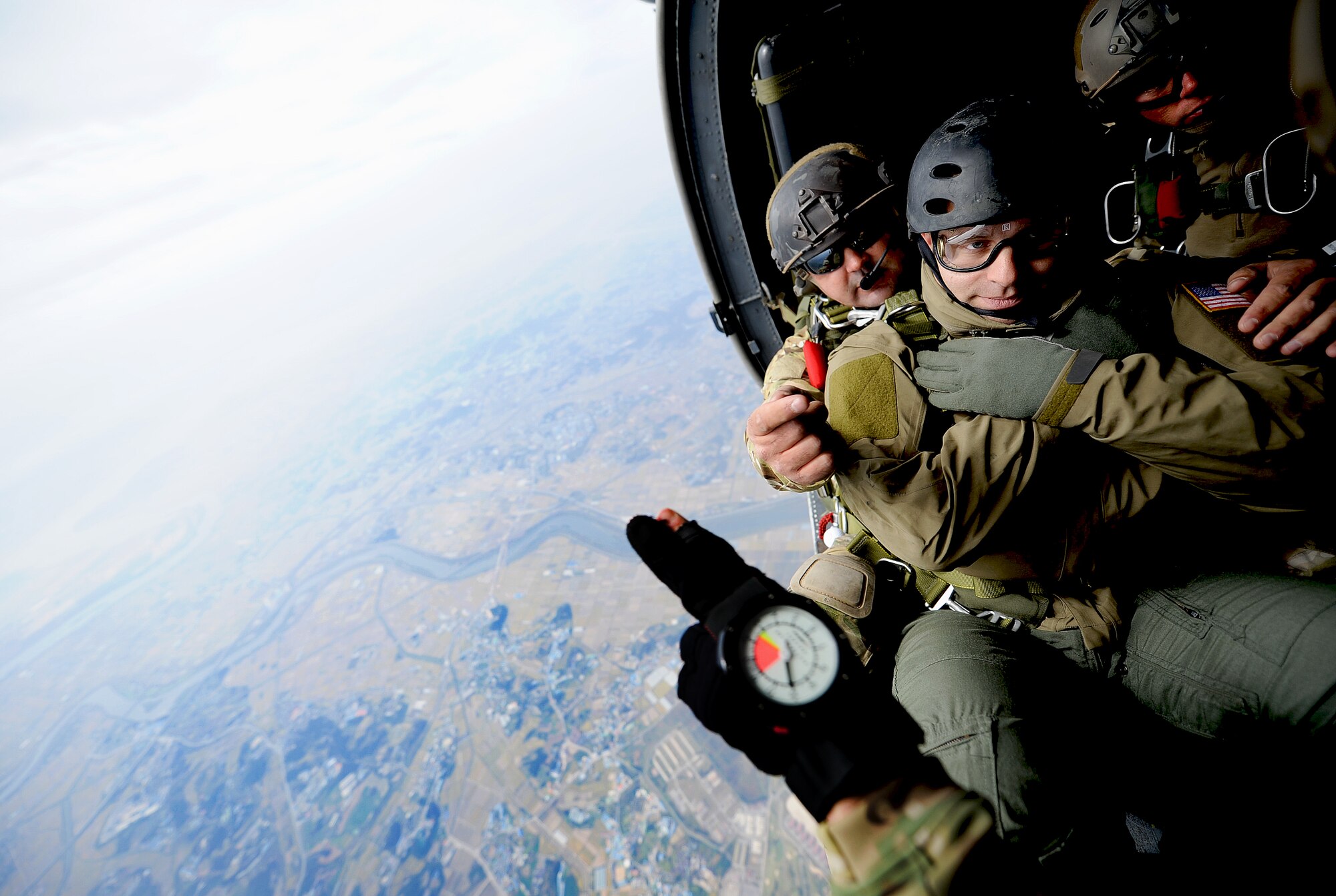 Tech. Sgt. Justin Schramm, 33rd Rescue Squadron A-flight chief, evaluator aerial gunner prepares to roll out of a 33rd RQS HH-60 Pave Hawk during Pacific Thunder 2012 at Osan Air Base, Republic of Korea, Oct. 13, 2012. Pacific Thunder is an annual two-week exercise that 31st and 33rd Rescue Squadron Airmen link up with the 25th Fighter Squadron and other units at Osan AB, to test combat search and rescue tactics to prepare for real-world emergencies. (U.S. Air Force photo/Staff Sgt. Sara Csurilla)
