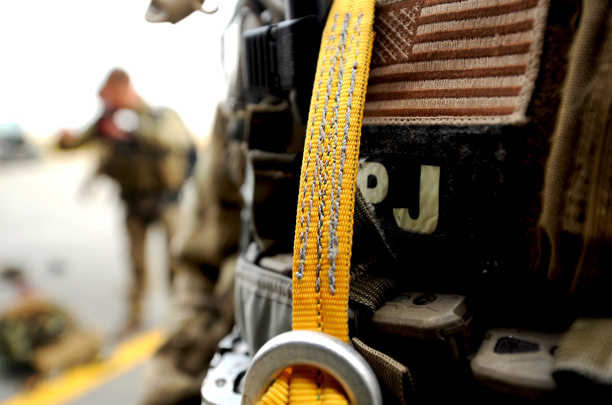 A pararescueman holds still while a fellow pararescueman inspects his gear before he jumps from an HH-60 Pave Hawk from the 33rd Rescue Squadron during Pacific Thunder 2012 at Osan Air Base, Republic of Korea, Oct. 13, 2012. Pacific Thunder 2012 is an annual two-week exercise that links up 31st and 33rd Rescue Squadron Airmen with the 25th Fighter Squadron and other units at Osan AB, to test combat search and rescue tactics to prepare for real-world emergencies. (U.S. Air Force photo/Staff Sgt. Sara Csurilla)