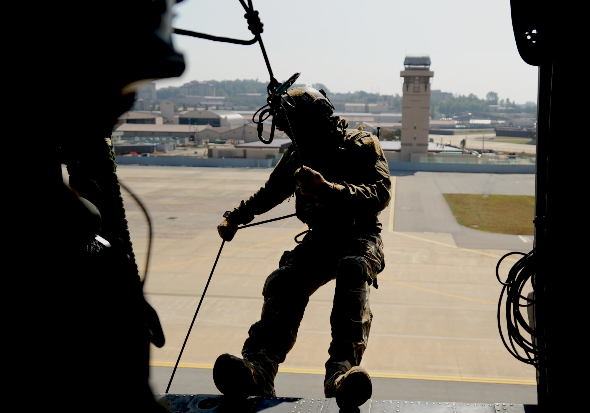 A 31st Rescue Squadron pararescueman performs alternate insertions and extractions from a 33rd Rescue Squadron HH-60 Pave Hawk during a combat search and rescue training scenario for Pacific Thunder at Osan Air Base, Republic of Korea, Oct. 12, 2012. Pacific Thunder is an annual two-week exercise that links up 31st and 33rd Rescue Squadron Airmen with the 25th Fighter Squadron and other units at Osan AB, to test CSAR tactics to prepare for real-world emergencies. (U.S. Air Force photo/Staff Sgt. Sara Csurilla)