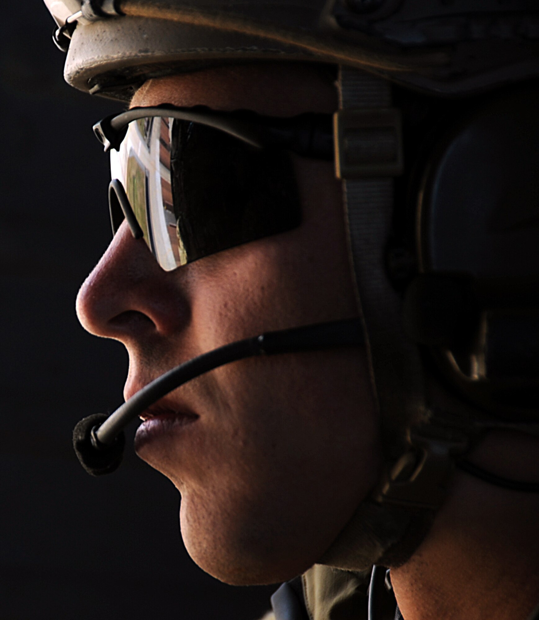 A 31st Rescue Squadron pararescuemen stares out of an HH-60 Pave Hawk during a combat search and rescue training scenario for Exercise Pacific Thunder at Osan Air Base, Republic of Korea, Oct. 12, 2012. Pacific Thunder is an annual two-week exercise that links up 31st and 33rd Rescue Squadron Airmen with the 25th Fighter Squadron and other units at Osan AB, to test CSAR tactics and prepare for real-world emergencies. (U.S. Air Force photo/Staff Sgt. Sara Csurilla)