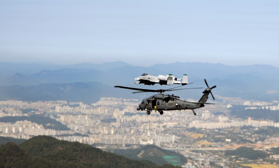 A 33rd Rescue Squadron HH-60 Pave Hawk and a 25th Fighter Squadron A-10 Thunderbolt II kick off the first day of Pacific Thunder 2012 during a combat search and rescue training mission at Osan Air Base, Republic of Korea, Oct. 12, 2012. Pacific Thunder is an annual two-week exercise where members of the 31st and 33rd Rescue Squadrons met up with the 25th Fighter Squadron and other units at Osan AB, to test CSAR tactics and prepare for real-world emergencies. (U.S. Air Force photo/Staff Sgt. Sara Csurilla)
