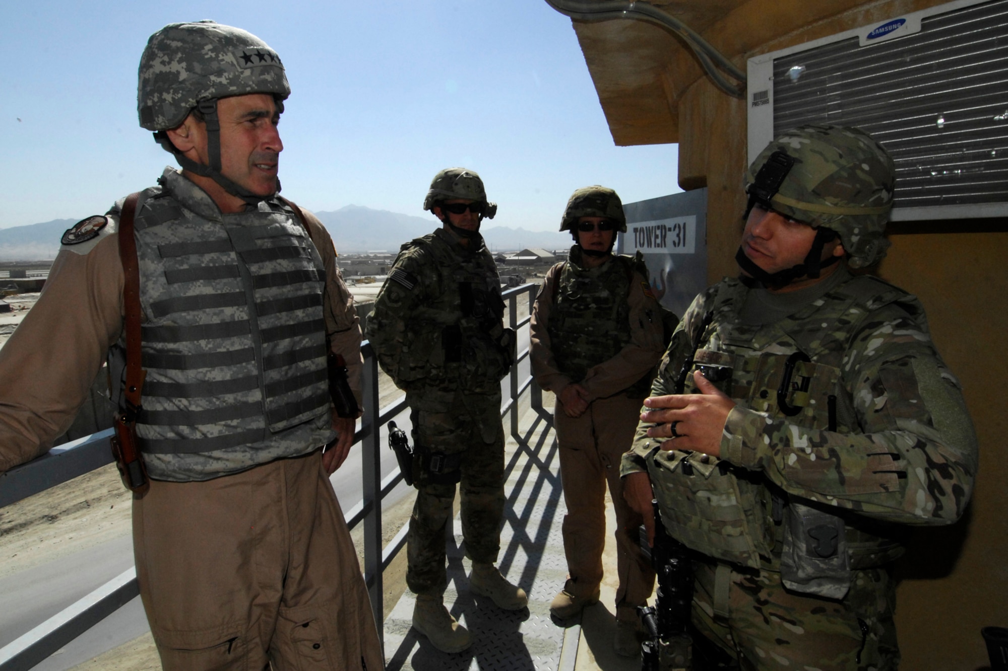 Gen. Raymond Johns, Jr., Air Mobility Command commander (left), speaks with MSgt Thomas Carpino, 455th Expeditionary Security Forces Squadron, during the general’s visit to Bagram Airfield, Afghanistan, Oct. 12, 2012. Johns thanked the men and women of the 455 ESFS for their diligence in protecting the perimeter of BAF. (U.S. Air Force photo/SSgt Jeff Nevison)