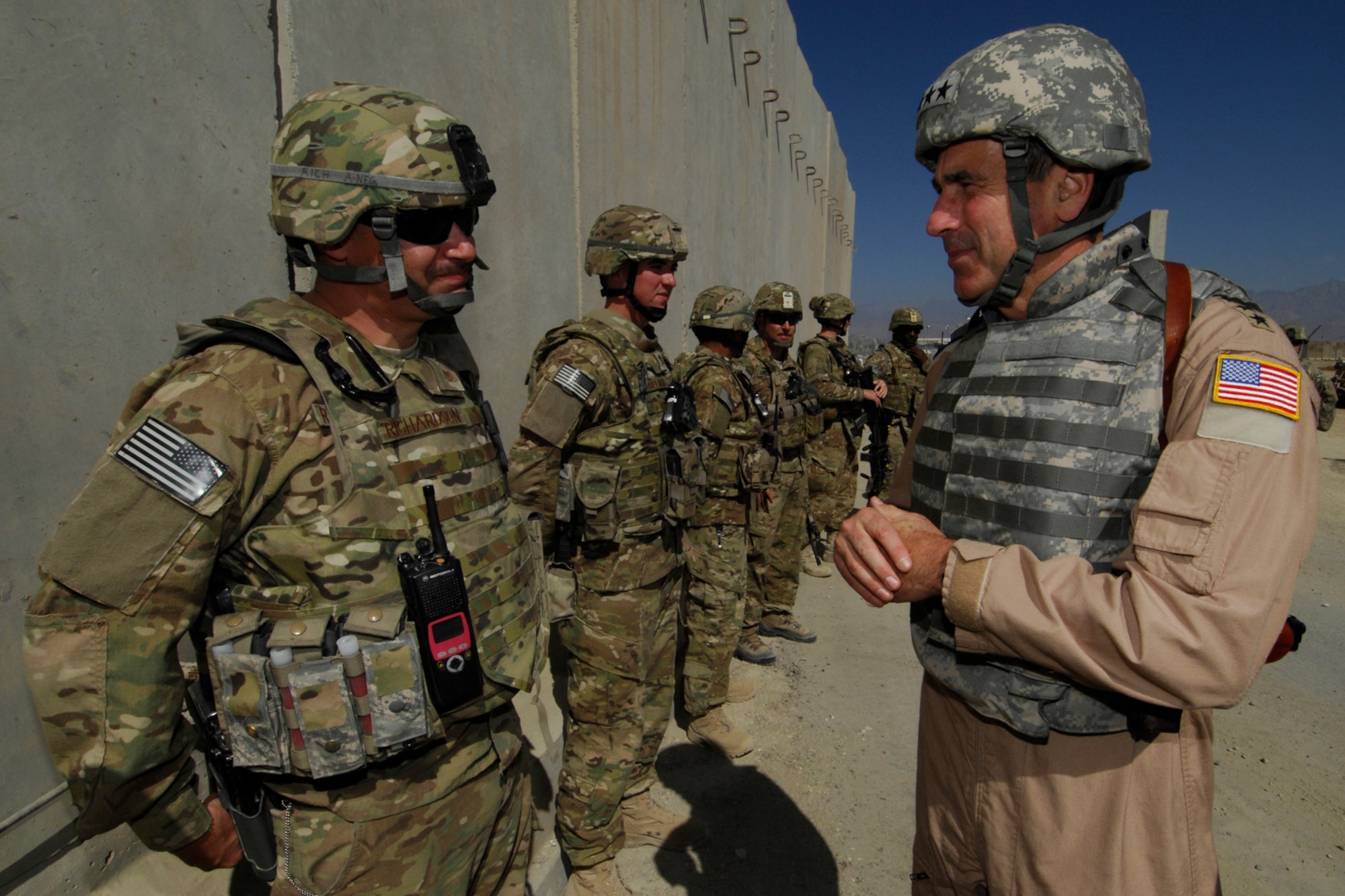 MSgt Andrew Richardson (left), 455th Expeditionary Security Forces Squadron Delta Sector NCOIC, speaks with Gen. Raymond Johns, Jr., Air Mobility Command commander, during the general’s visit to Bagram Airfield, Afghanistan, Oct. 12, 2012. Johns thanked the men and women of the 455 ESFS for their diligence in protecting the perimeter of BAF. (U.S. Air Force photo/SSgt Jeff Nevison)