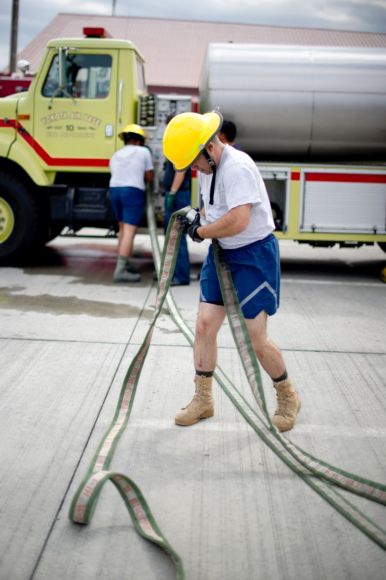 YOKOTA AIR BASE, Japan -- Master Sgt. Michael Shortsleeves, 374th Communications Squadron, assembles a fire hose during the Fire Prevention Week Fire Muster Competition at Yokota Air Base, Japan Oct. 12, 2012. The activities during the fire muster included equipment carries, hose hoisting, litter carries and more, simulating some of typical tasks a firefighter might face when combating a fire. (U.S. Air Force photo by Staff Sgt. Stacy Moless)     