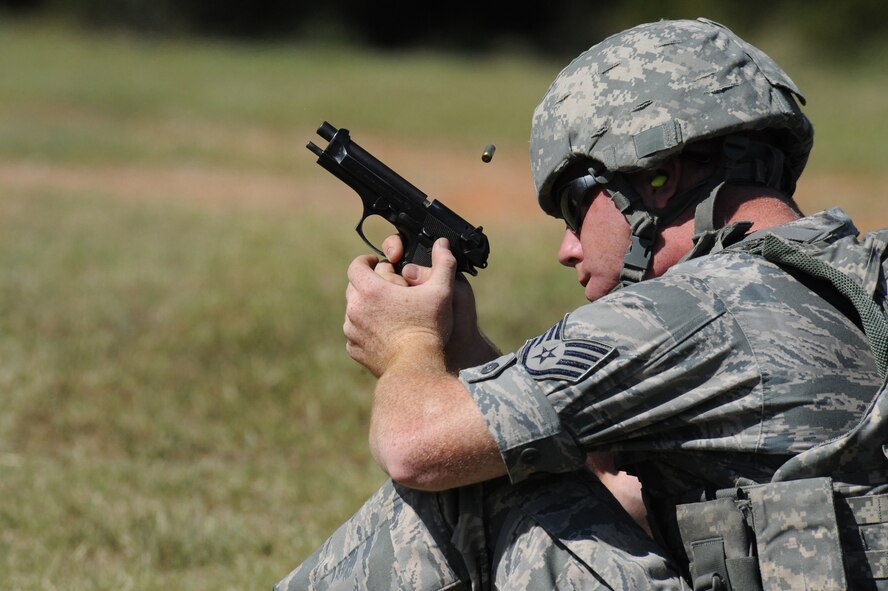 Staff Sgt. Jamie Farmer, 2nd Security Forces Squadron patrolman, fires an M-9 pistol from a seated position at  the Bossier Parish Sheriff's Office pistol range in Plain Dealing, La., Sept. 11. Select Airmen from the 2 SFS visited the range to prepare for the 2012 annual Global Strike Challenge. The Airmen practiced shooting in various stances, distances and targets to prepare them for the competition. (U.S. Air Force photo/Senior Airman Micaiah Anthony)(RELEASED)