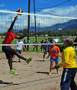 Army Capt. Ballah Howard, Commander, Headquarters and Service Company, Joint Task Force Bravo jumps to hit the ball during a volleyball match against the Honduran military's senior leaders at Cameraderie Day, October 12. Senior leaders from JTF-Bravo and senior leaders from the Honduran military competed against one another in soccer, volleyball and dodgeball at Soto Cano Air Base, Honduras. The Honduran senior leaders won two of three contests to come away with the first win. The event will take place semi-annually. (Air Force photo by Master Sgt. Brannen Parrish)