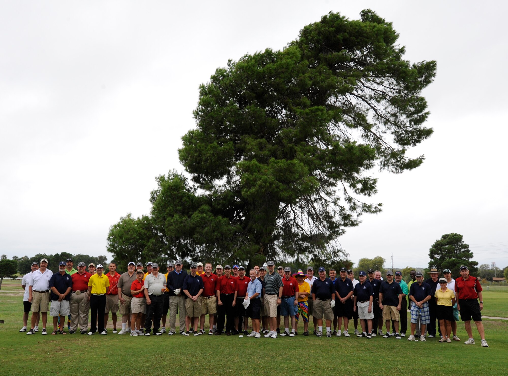 Competitors in the 40th annual Commander’s Golf Tournament pose in front of ‘the leaning pine’ of the Leaning Pine Golf Course at Laughlin Air Force Base, Texas, Oct. 13, 2012. Participants, made up of past and present Laughlin personnel and Del Rio community figures, came together to celebrate Laughlin’s unique relationship with the people of Del Rio. (U.S. Air Force photo/ Airman 1st Class Nathan Maysonet)
